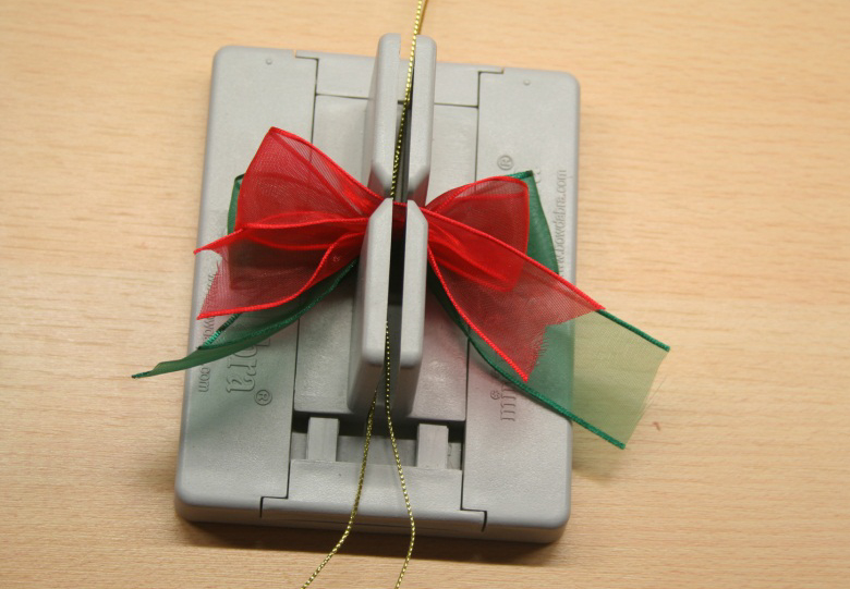 Rudolph the Red Nose Reindeer's Wife Treat Bags make a reindeer bow