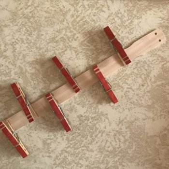 Glue Clothespins on Paint Stir